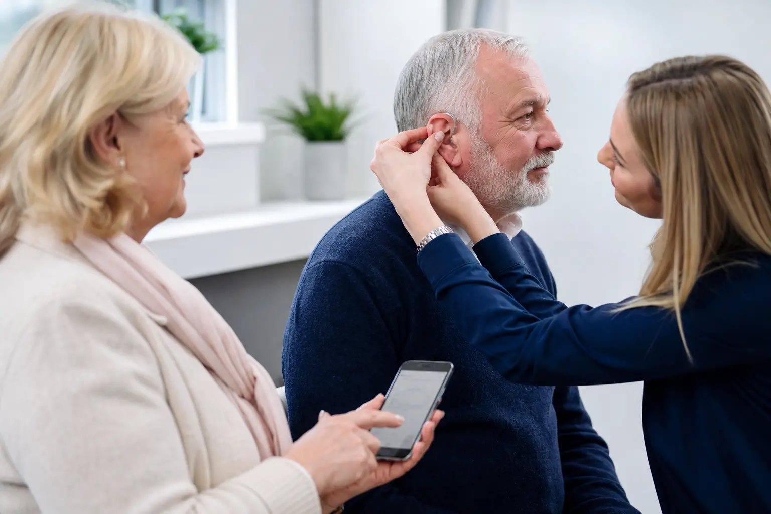 Audiologist providing hearing care to a patient